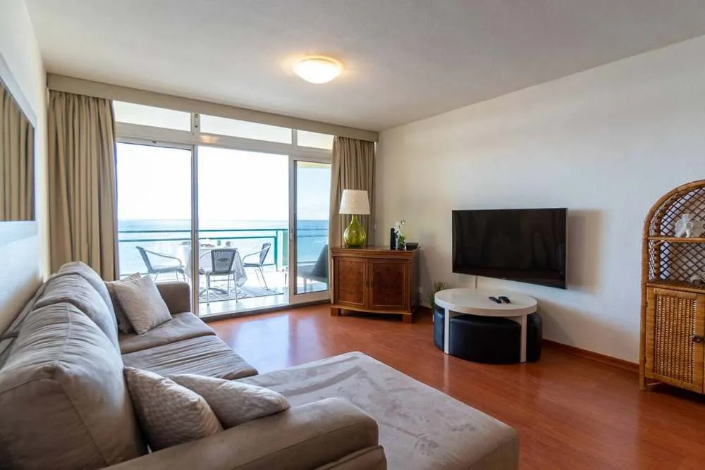 Large lounge leading onto the balcony.