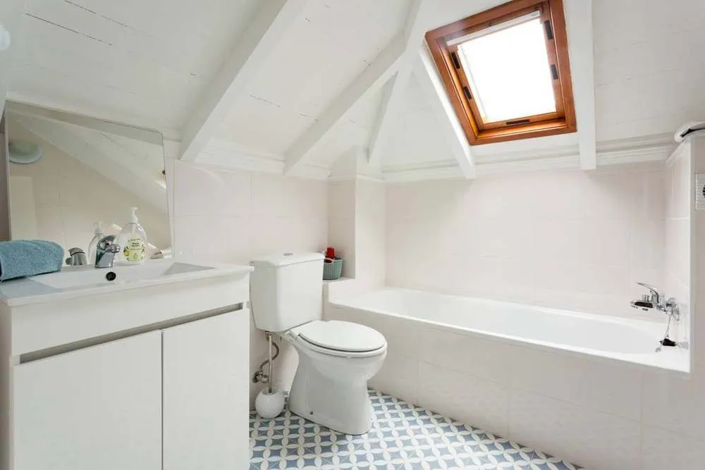 The second bathroom has a bath.