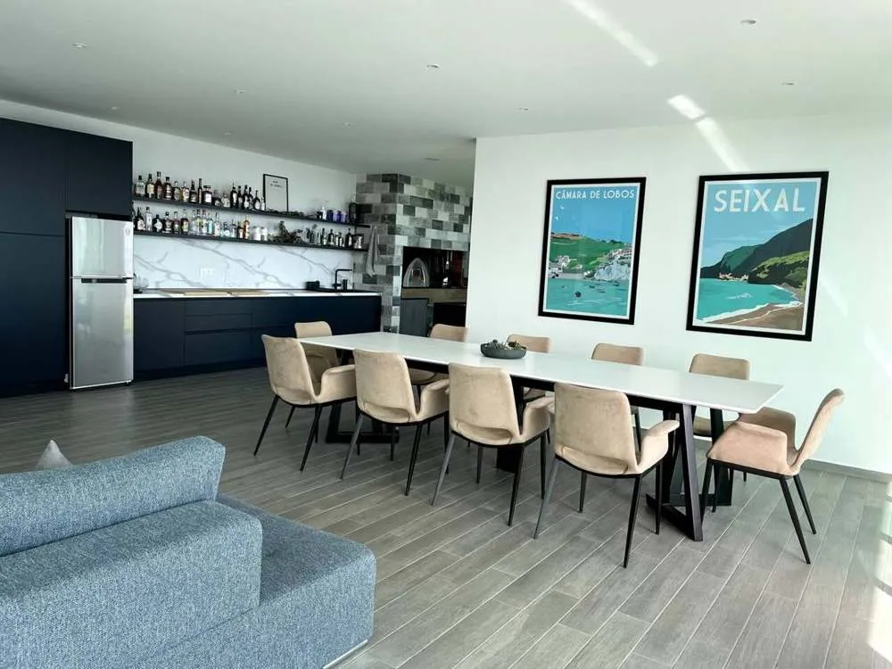 Fully equipped entertainment area with indoor/outdoor dinning area, fridge, stove, sink, barbecue and lounging area.