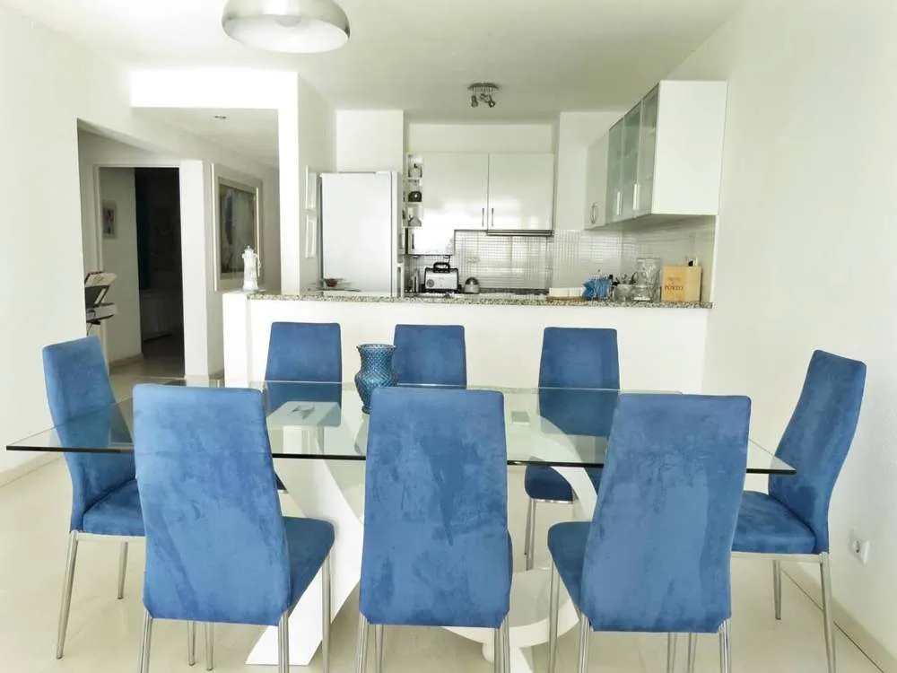 Dining area and fully-equipped kitchen.