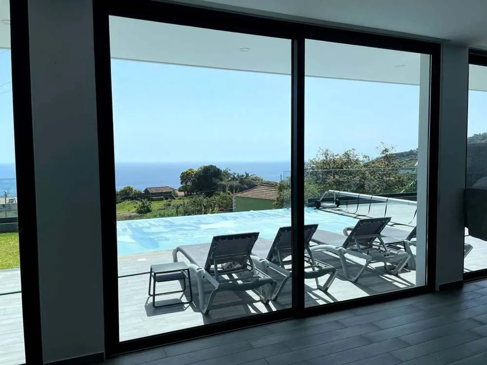 Pool and sea views through the sliding doors.