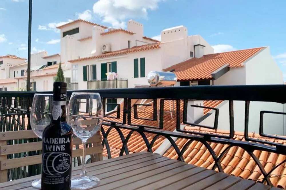 Enjoy a bottle of Madeira wine on the balcony.