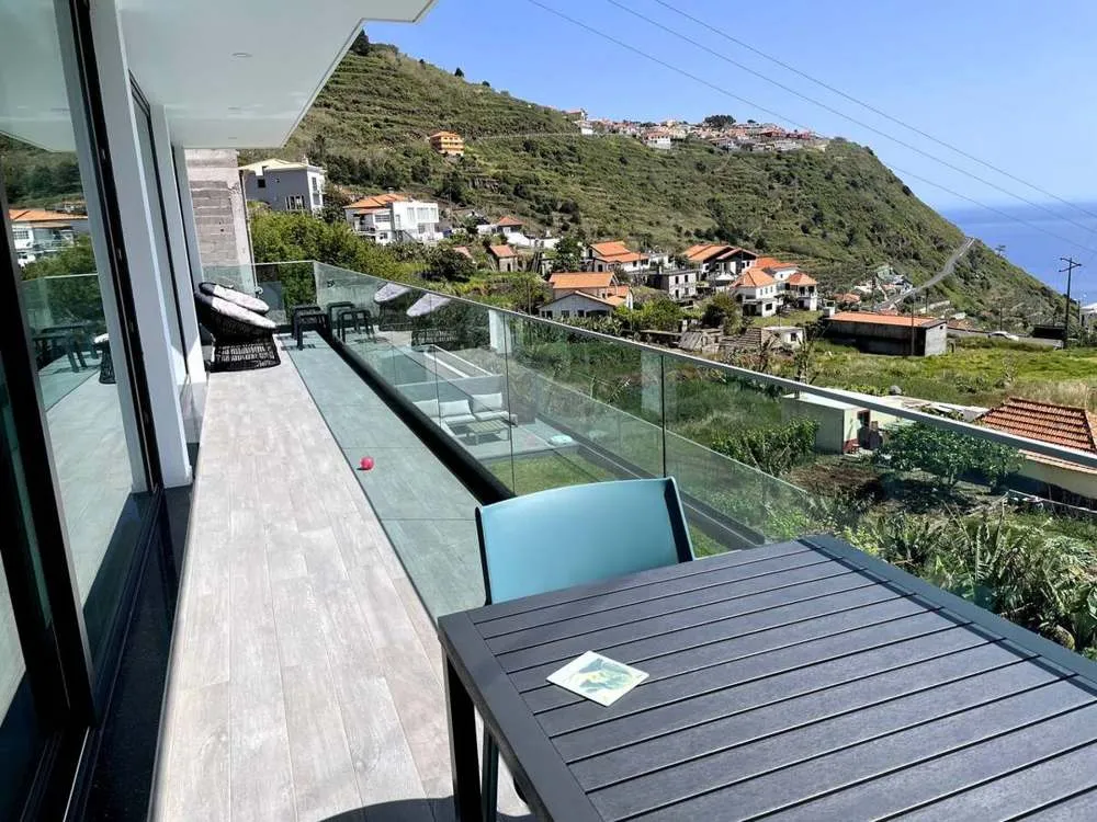 Enjoy the breathtaking views from the upstairs balcony. Equipped with a small dining area & lounging chairs. The balcony is off the bedrooms and upstairs lounge and kitchen.