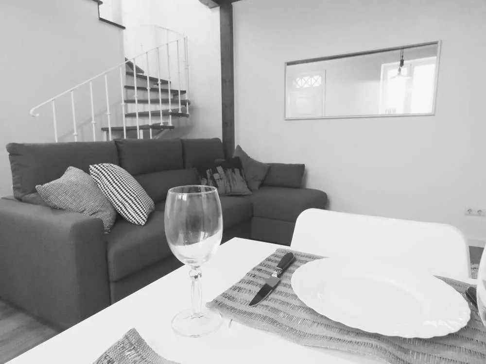 Enjoy a glass of wine while you relax on the sofa.