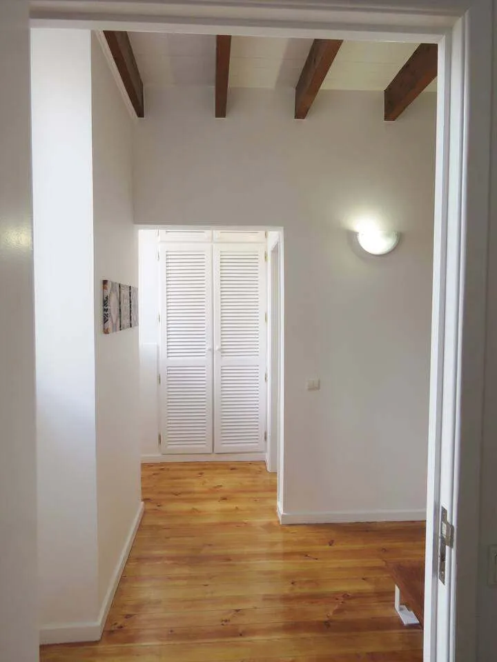 The hall way on the first floor has lots of storage space.