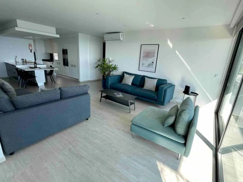 Large upstairs lounge leading from the kitchen to the outdoor balcony with sea and mountain views. A great area to relax, connect with friends and family and enjoy the views. Fully equipped with AC.
