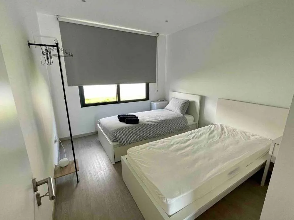 The 3rd bedroom, equipped with twin beds, garden facing.