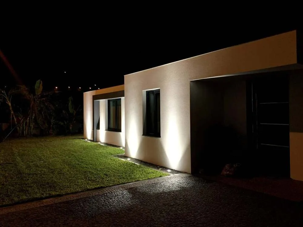The villa lit up at night.